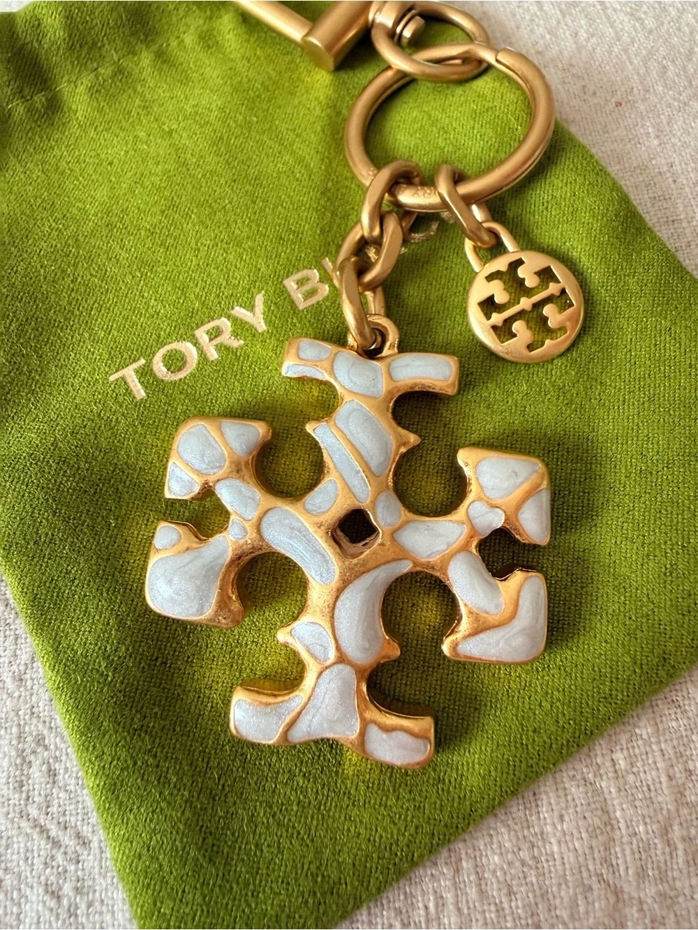 Tory Burch Gold-Tone Key / Bag Charm with White Enamel Logo